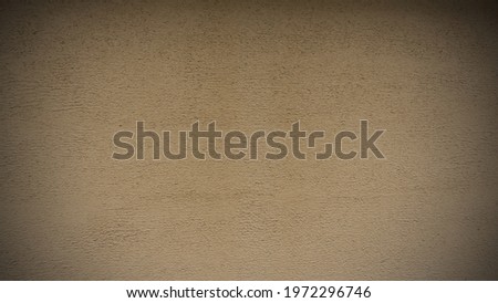 The light brown color of rough texture concrete wall skin with random pattern cement plaster on its surface