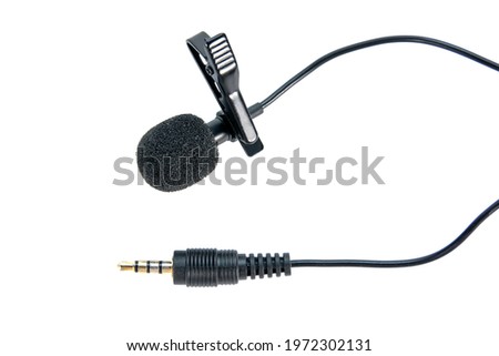 Wireless microphone clip with mini 3.5 jack audio isolated on white background. Black small microphone lapel or lavalier isolated