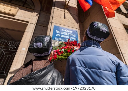 Russia. Saint-Petersburg. Victory Day celebration. Laying flowers at the memorial on May 9. Translation: Citizens! During the shelling, this side of the street is the most dangerous.