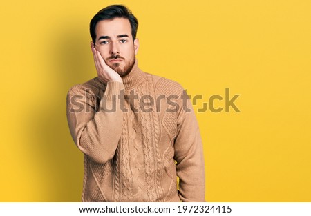 Young hispanic man wearing casual clothes thinking looking tired and bored with depression problems with crossed arms. 