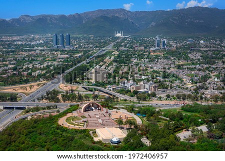 Islamabad is the capital city of Pakistan, and is administered by the Pakistani federal government as part of the Islamabad Capital Territory. Royalty-Free Stock Photo #1972406957
