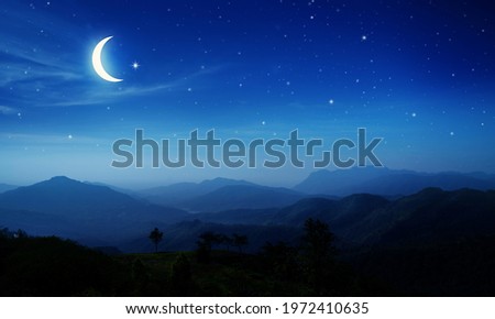 Panorama view of Night sky and moon, stars,Ramadan Kareem celebration.Serenity mountain background, outdoor.