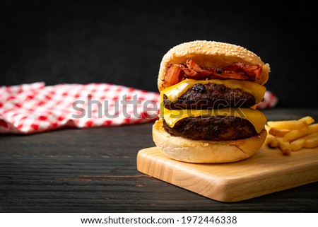 hamburger or beef burgers with cheese and bacon - unhealthy food style