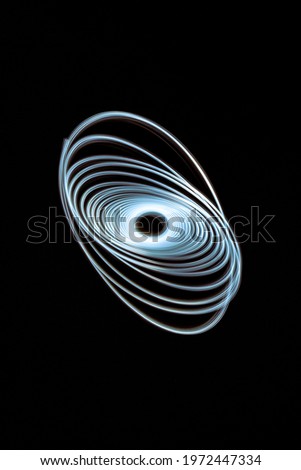 White light spiral on black background taken with long exposure photo technique