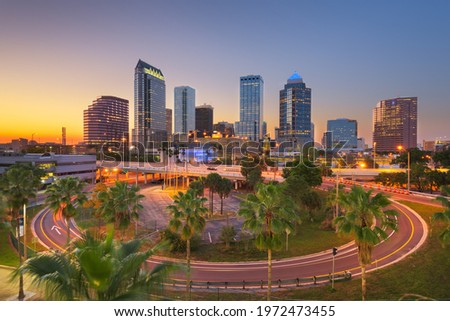 Tampa, Florida, USA downtown city skyline over roads and highways at dusk.