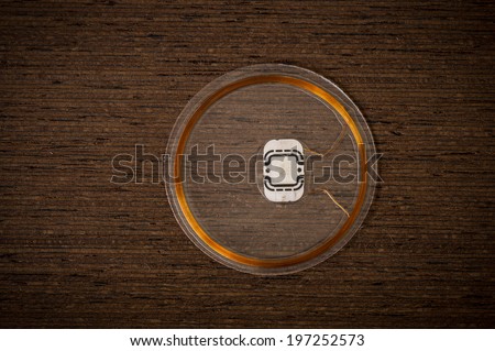 RFID Chip on dark Wenge wood Texture with Vignette