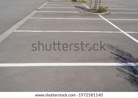 Empty parking lot with white stripes