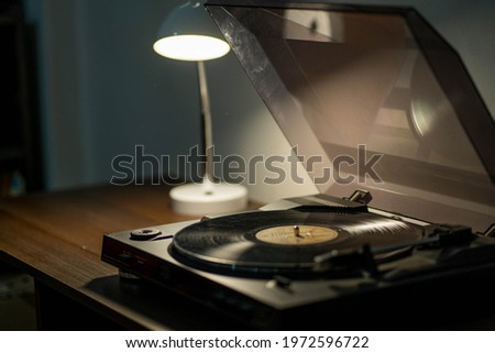vinyl player with warm backlighting, horizontal picture