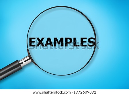 The word EXAMPLE text on a magnifying glass on a background. Royalty-Free Stock Photo #1972609892