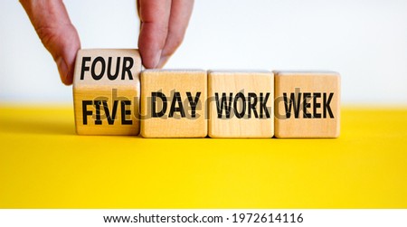 4 or 5 day work week symbol. Businessman turns the cube, changes words 'five day work week' to 'four day work week'. Beautiful white background. Copy space. Business and 4 or 5 day work week concept. Royalty-Free Stock Photo #1972614116