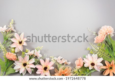 Abstract floral composition flat layout, the background, the concept of minimum holiday with flowers, spring banner. Lotus flowers on a gray table. Mother's day card, happy birthday, wedding,