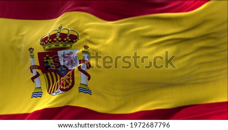 close up view of the Spanish national flag waving in the wind. Selective focus.