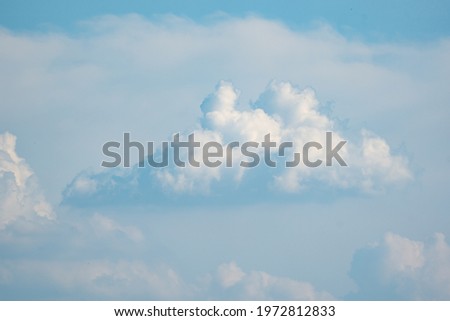 Blurred blue sky and white clouds on daytime background