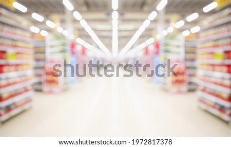 supermarket aisle and shelves blurred background Royalty-Free Stock Photo #1972817378