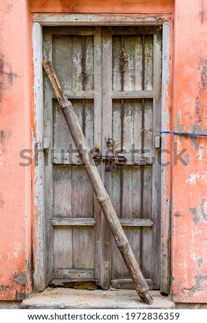 Picture of a vintage wooden door entrance of an abandoned building in north Kolkata.