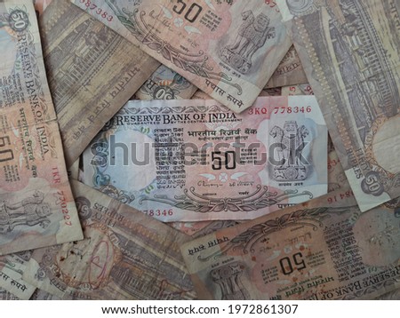 some Rs.50 Indian old currency are placed in random positions  Royalty-Free Stock Photo #1972861307