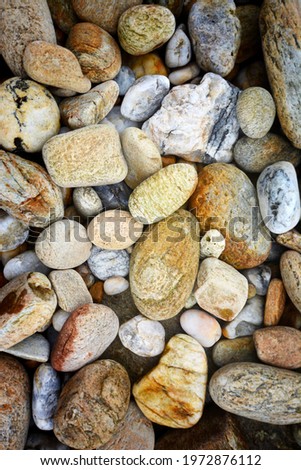   Many colorful pebbles on the beach