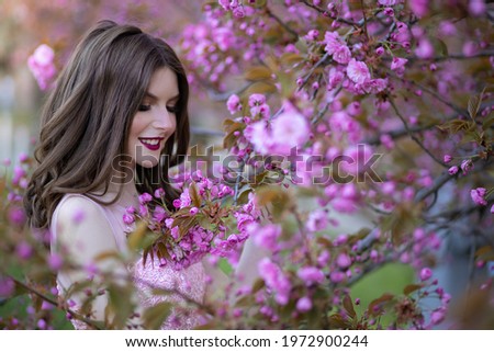 Spring photography girl in sakura in a fairy tale