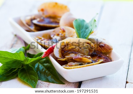 STIR FRIED CLAMS WITH CHILI PASTE AND THAI BASIL LEAVES. 