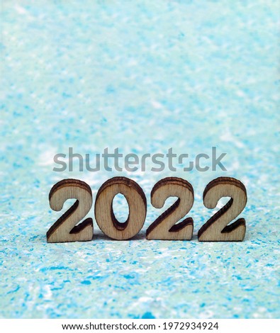Banner 2022. Figures 2022 on blue background. Wooden figures on blue background. New Year's calendar.