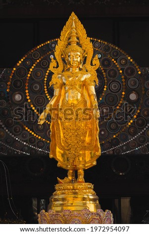 Shining towering golden buddha statue 