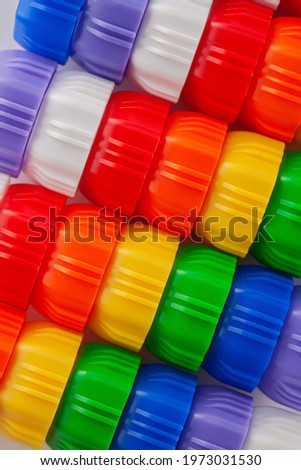 Multi-colored designer background. Concept of children's play, creativity and development of fine motor skills, classes for intelligence. Rainbow colors. 