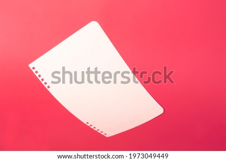 a piece of paper lies on a bright background