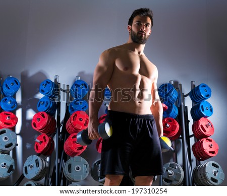 Dumbbell man workout fitness club at weightlifting gym