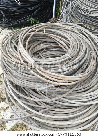 photo of stacked waste power cord reels
