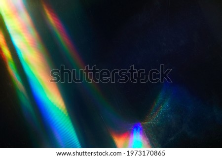 Blurred Rainbow Flare with Vintage Effect on Film. Dust and scratches. Overlay Bokeh Light Leaks Retro Reflection. Abstract blurred glittering shine background and colorful flare.