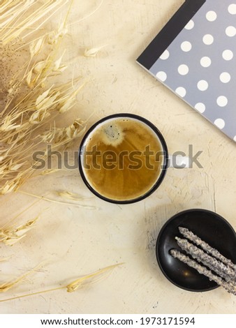 a white coffee cup on a beige table