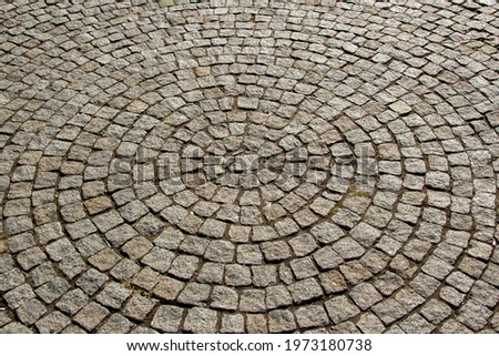 gray stone paving stones in the shape of a circle, gray background, stones, circles,