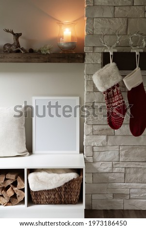 16x20 vertical Christmas and winter frame mockup. Cosy,  interior setting next to a fireplace and hanging Christmas stockings.