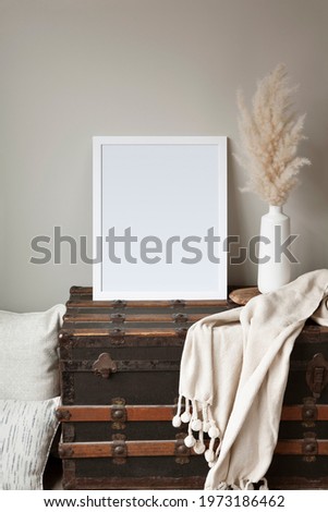 16x20 vertical fall or winter frame mockup. Cosy, bohemian style interior setting with vintage props.