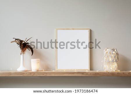 8x10 small, thin wood, vertical frame mockup for art and quotes. Bohemian style props on a light wooden shelf.