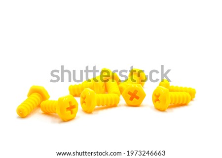 Isolated Photos of Children's тoys constructor plastic screws and Nuts