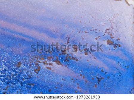 Abstract blue art with gold — close up background with beautiful smudges, stains and brush strokes made with alcohol ink. Volumetric fluid art texture resembles oil painting on canvas.