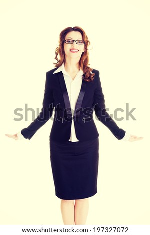 Happy business woman showing copy space on her palm