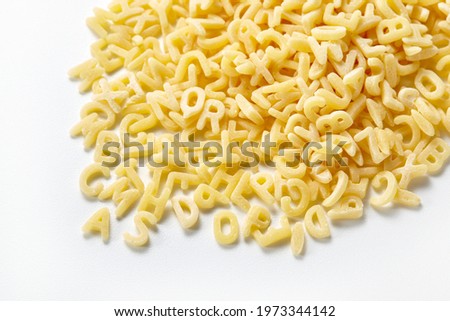 Alphabet pasta, also referred to as alfabeto and alphabetti spaghetti in the UK, It is a pasta that has been mechanically cut or pressed into the letters of the alphabet.  Royalty-Free Stock Photo #1973344142