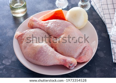 raw chicken legs, onions, carrots, prepared for cooking soup broth, horizontal