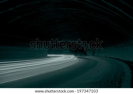 Truck and car light trails in tunnel. Art image . Long exposure photo taken in a tunnel 