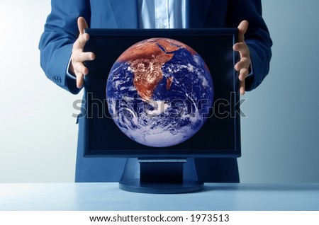 businessman holding an lcd monitor
