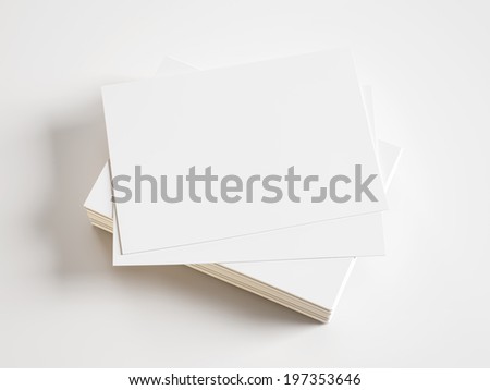 Pile of blank business cards on white background