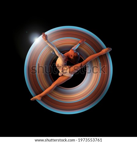 Little african girl, rhythm gymnast in neon light on black background. Concept of motion and action in sport. Training in jump, flight. Sport, healthy lifestyle, movement, advertising. Abstract design