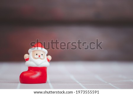 Doll Santa claus in the red sock. Merry christmas and happy and happy new year.