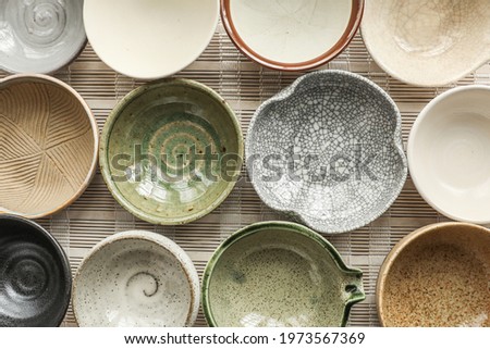ceramic bowls for drinks close-up. Ceramic ware made by own hands Royalty-Free Stock Photo #1973567369
