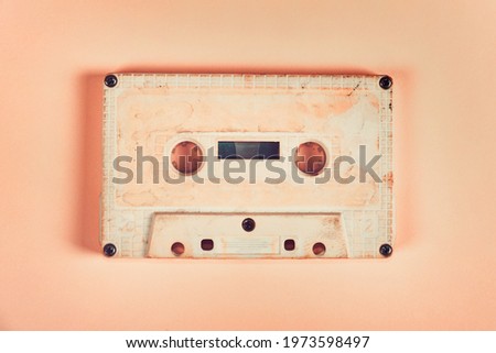 Toned Photo of the Old Audio Cassettes on the Paper Background closeup