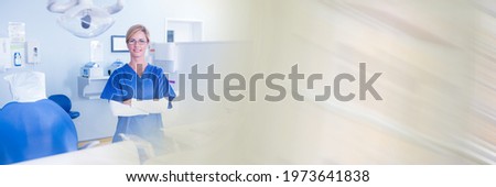 Composition of smiling female dentist in surgery with blurred light trails. dentistry concept digitally generated image.