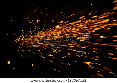 Glowing Flow of Sparks in the Dark Royalty-Free Stock Photo #197367152