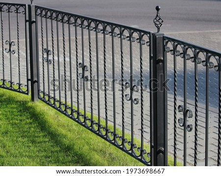 neat fence on the territory of city streets